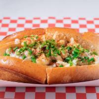 Connecticut-Style Dungeness Crab Roll · Served warm. Dungeness crab meat tossed with melted butter ＆ fresh-squeezed lemon juice. Top...