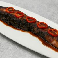 Thick-cut Nueske's Bacon · Bourbon molasses glaze.