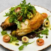 Roasted Chicken · Arugula, heirloom tomato vinaigrette, olive tapenade.