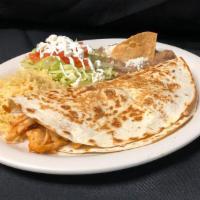 Quesadilla Supreme · Large flour tortilla with a small side salad.