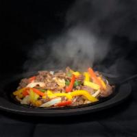 Steak Sizzling Fajitas · Sauteed with onions and peppers with a side salad and sour cream.