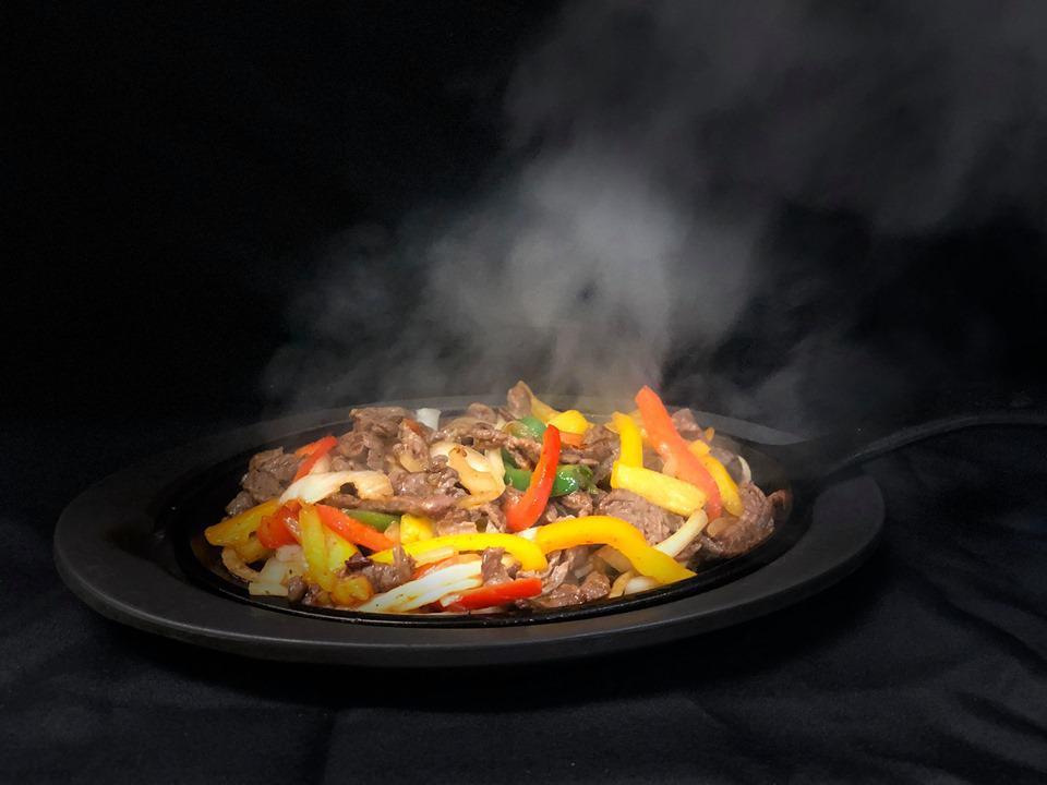 Steak Sizzling Fajitas · Sauteed with onions and peppers with a side salad and sour cream.