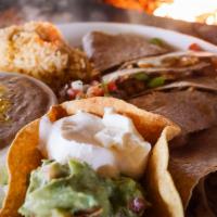 Fajita Quesadilla · A giant wheat tortilla filled with your choice of our chicken or steak fajita meat, grilled ...