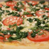 Spinach Feta Tomato Pizza · Fresh spinach, feta cheese, and Roma tomatoes topped with basil.