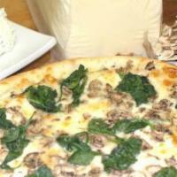 White Pesto Pizza · Mozzarella, ricotta, spinach, mushrooms and our homemade pesto sauce.