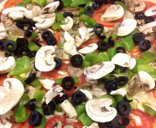 Vegetarian White Pizza · Mozzarella, ricotta, tomato, mushroom, green pepper, onion, and olive.
