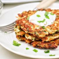 German Potato Pancakes · Shredded Russet potatoes, onion, garlic, egg, peppers & spices.  Served w/ sour cream