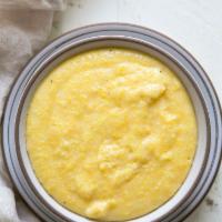 Mascarpone Polenta · Creamy yellow corn polenta w/ fresh herbs, spices, cream, Parmesan & Mascarpone 
