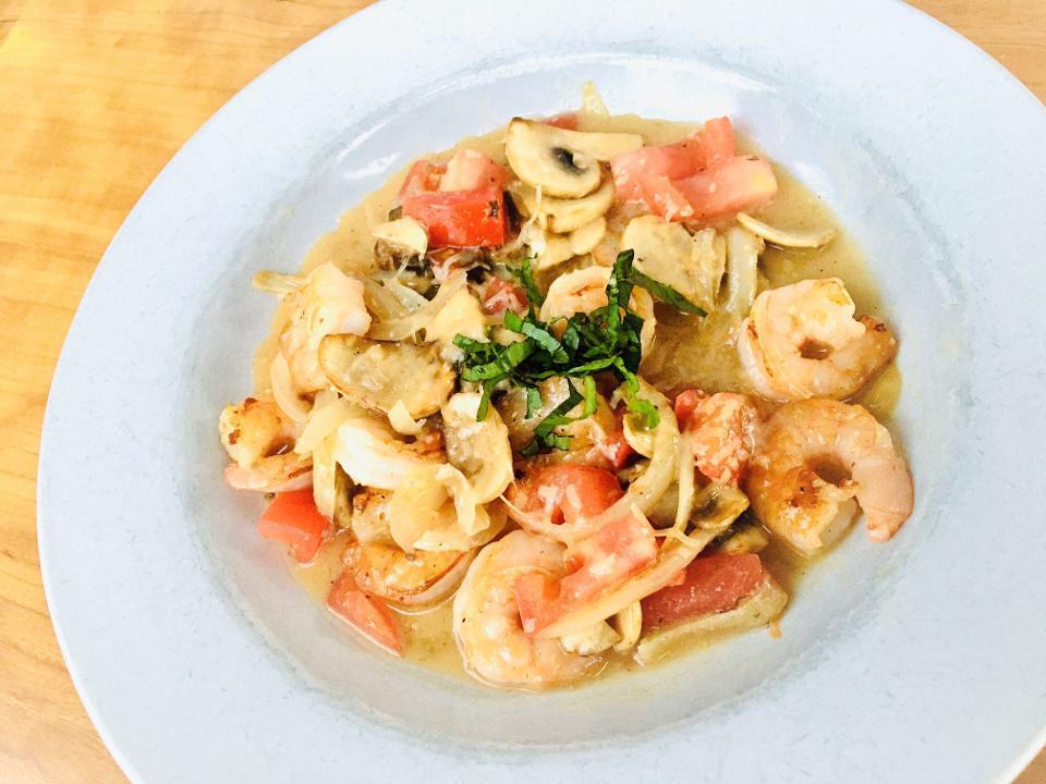 GF Shrimp “Scampi Style” · White shrimp sautéed in white wine butter sauce w/ roasted garlic, tomato, basil & mushrooms