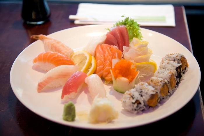 Sushi and Sashimi Combination · Ten pieces of sashimi, five pieces of sushi and one California roll. Served with soup or salad.