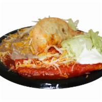 5. Shredded Beef Taco and Enchilada Combination Plate · Served with rice and beans.