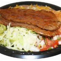 12. Carne Asada Combination Plate · Served with rice and beans.