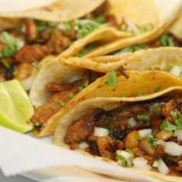 Al Pastor Tacos · Pastor style pork with pineapple.