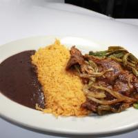 Bistec Rajas con Nopales · Steak with poblano strips and cactus.