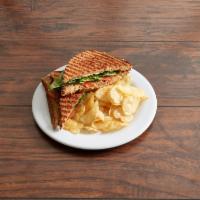 Grilled TLT Panini · Our version of the BLT. Smoked tempeh, tomatoes, lettuce and vegan cheese on grilled wheat b...