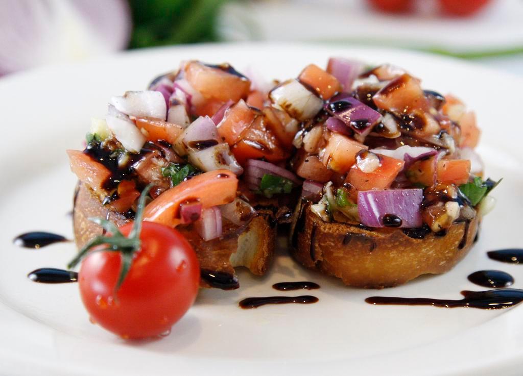 Bruschetta (3 pieces) · Garlic rubbed and toasted italian bread covered with diced tomatoes, onions, garlic, basil, olive oil and balsamic glaze