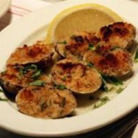 Baked Clams Oreganata (6) · Clams stuffed with our signiture oreganata bread crumb recipe served with lemon wedges