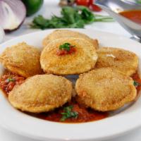 Fried Ravioli (6) · Cheese filled ravioli covered in our breadcrumb batter and deep fried to perfection