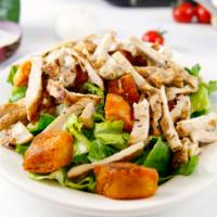 Grilled Chicken Caesar Salad · Grilled chicken served over romaine lettuce, croutons and caesar dressing. Dressing is serve...