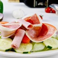 Antipasto Salad · Ham, pepperoni salame and provolone cheese over iceberg lettuce, tomatoes, cucumbers, julien...