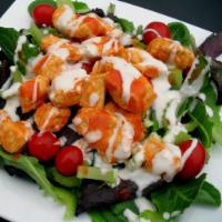 Buffalo Chicken Salad · Grilled or fried chicken breast served over romaine lettuce, tomatoes, hot sauce and blue ch...