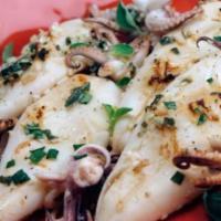 Grilled Calamari Salad · Our calamari get to marinate in lemon juice, spices and extra virgin olive oil before they h...