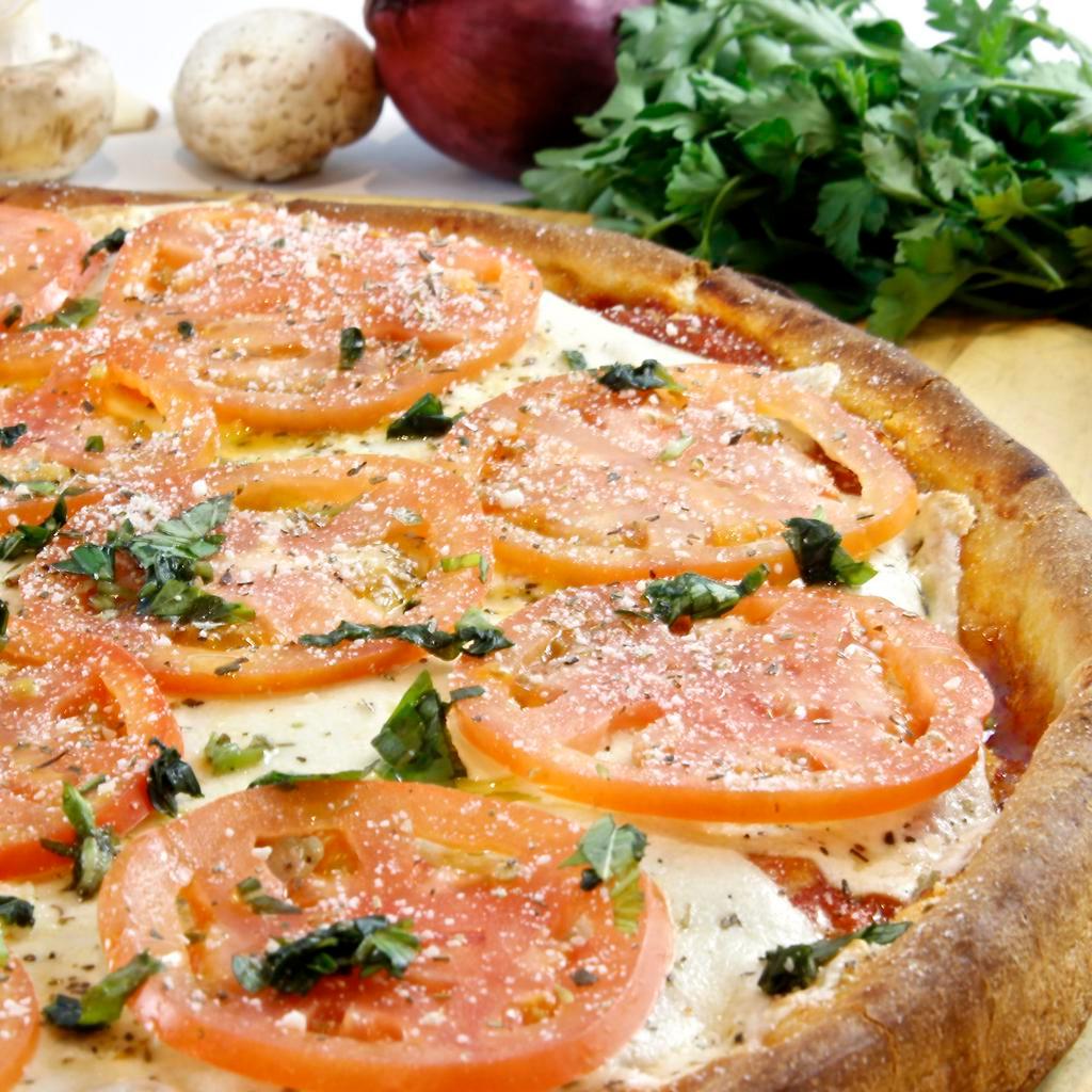 Sofia Loren Pan Pizza Slice · Pizza comes with fresh mozzarella, sliced tomatoes, tomato sauce, fresh garlic and basil chiffonade