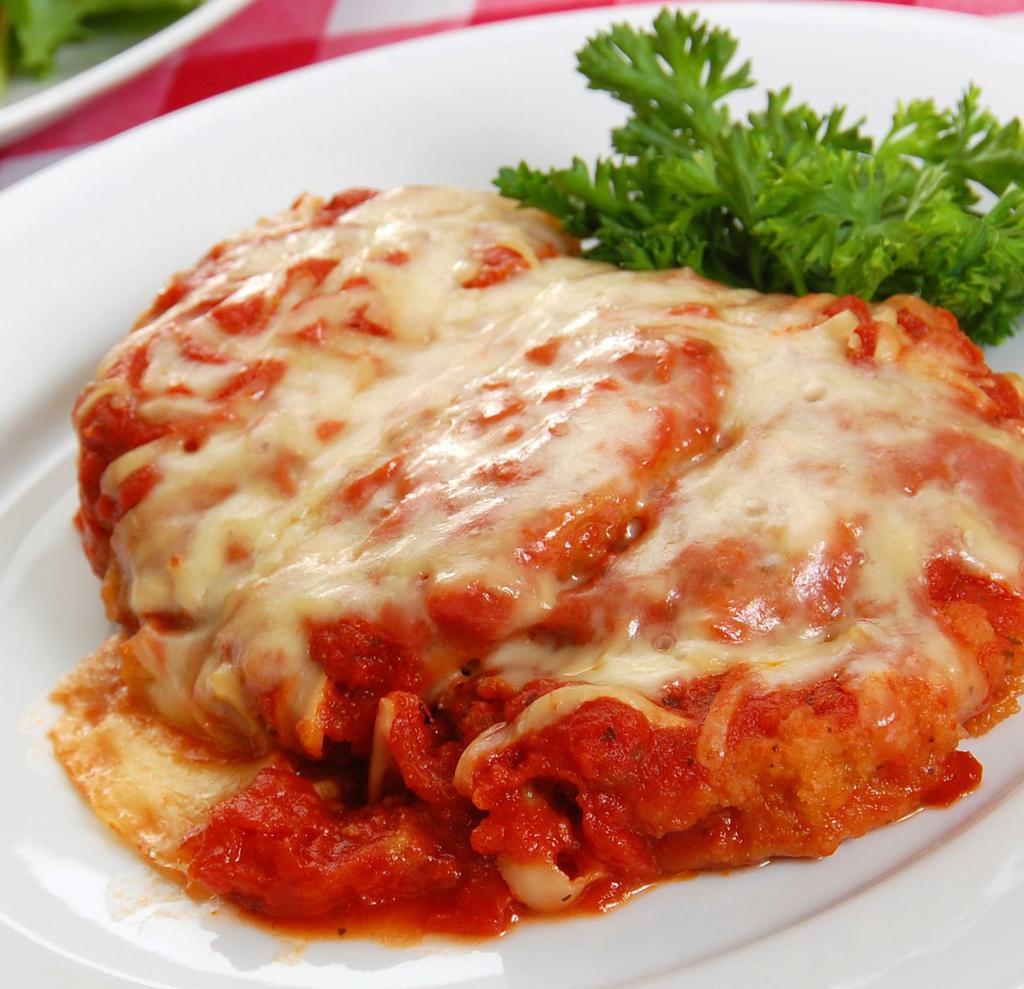Chicken Parmigiana · Breaded and fried chicken cutlets then oven baked with tomato sauce and mozzarella. Served with your choice of side.