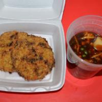 C15. Chicken Egg Foo Young · Peas, carrot, bamboo shoots, mixed in a brown gravy poured on top of 2 egg foo young patties.