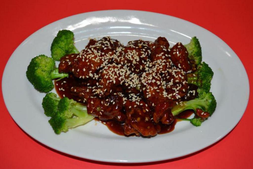 C17. Sesame Chicken · Deep fried crispy battered dark meat chicken chunks tossed in a sweet brown sesame sauce garnished with broccoli.