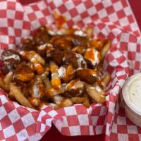 Buffalo Chicken Fries · Crispy Fries topped with Popcorn Chicken, Buffalo Sauce & Ranch