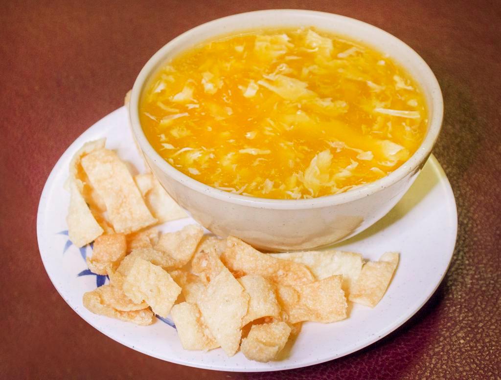Egg Drop Soup · Silky beaten eggs simmered in a house-made broth. Served with a side of fried noodles.