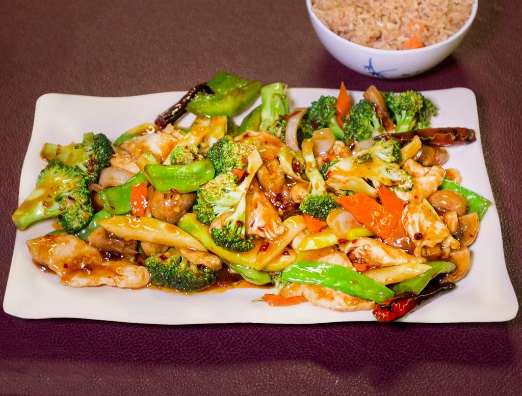 C2 - Hunan Chicken · White meat chicken, broccoli, carrots, cabbage, onion, snow peas, mushroom, sauteed and panfried in a spicy hunan style sauce. Served with a side of rice. Spicy.