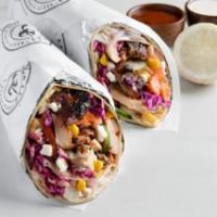 Roasted Chicken Dürüm Wrap · ****Served in a tortilla wrap****: This great-to-share wrap is offered with your choice of s...