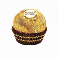 Ferrero Rocher (Hazelnut Chocolate) · A tempting combination of smooth chocolaty cream surrounding a whole hazelnut within a delic...