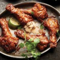 Duck Wings (Brunch) · Crispy duck wings, Brick Sauce and cilantro with sriracha ranch.