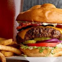 Bison Burger (Brunch) · Candied thick-cut bacon, jalapeño-cilantro mayo, cheddar cheese, lettuce, tomato, pickles, a...