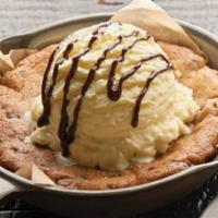 Gooey Chocolate Chip Cookie (Brunch) · Fresh baked and topped with vanilla ice cream and chocolate drizzle.