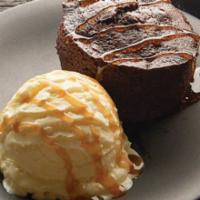 Chocolate Excess Cake (Brunch) · Rich chocolate mini-bundt cake filled with dark chocolate and topped with vanilla ice cream ...