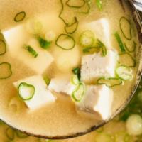 Miso Soup · Hot miso soup with seaweed, tofu, and scallion