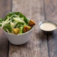 Caesar Salad · Romaine lettuce tossed with Caesar dressing, croutons and Parmesan cheese.