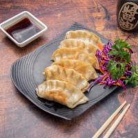 Gyoza · Pork and vegetable dumpling.