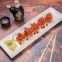 Spicy Tuna on the Rocks · Spicy tuna on the top of a crispy rice ball with eel sauce.
