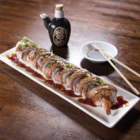 Moo Roll · Shrimp tempura, Kanikama salad, topped with seared rib eye steak, scallions and kabayaki sau...
