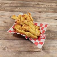 Breadsticks · Garlic butter-laden twists. Approximately 10-12 in a single order. Served with a side of sig...