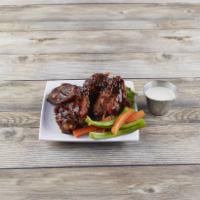Wings · Choose from traditional buffalo wings only hotter or BBQ wings, all served with carrots, cel...