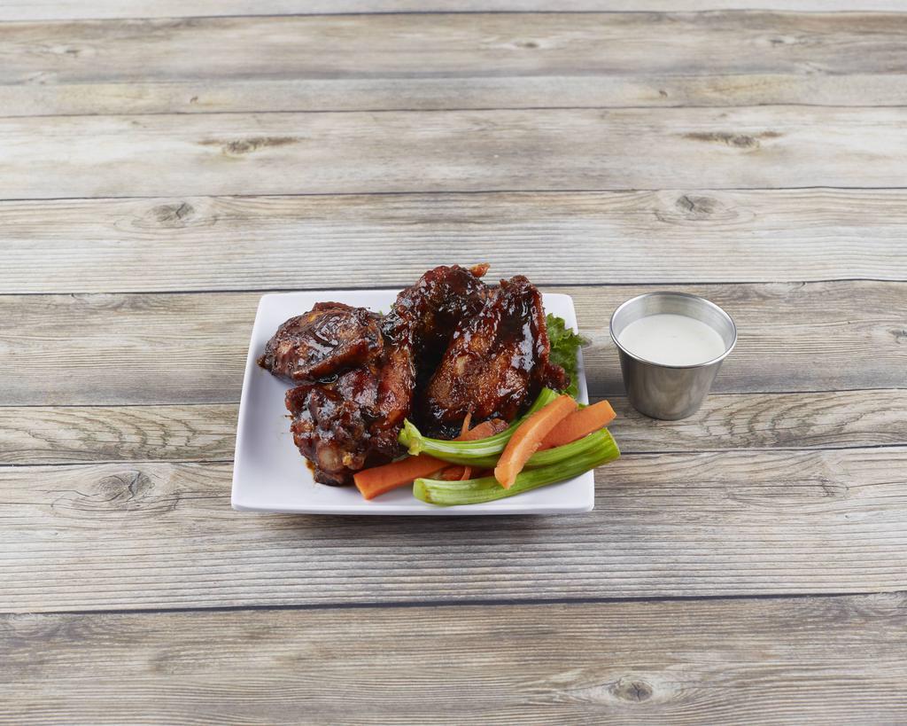 Wings · Choose from traditional buffalo wings only hotter or BBQ wings, all served with carrots, celery and bleu cheese dressing. 