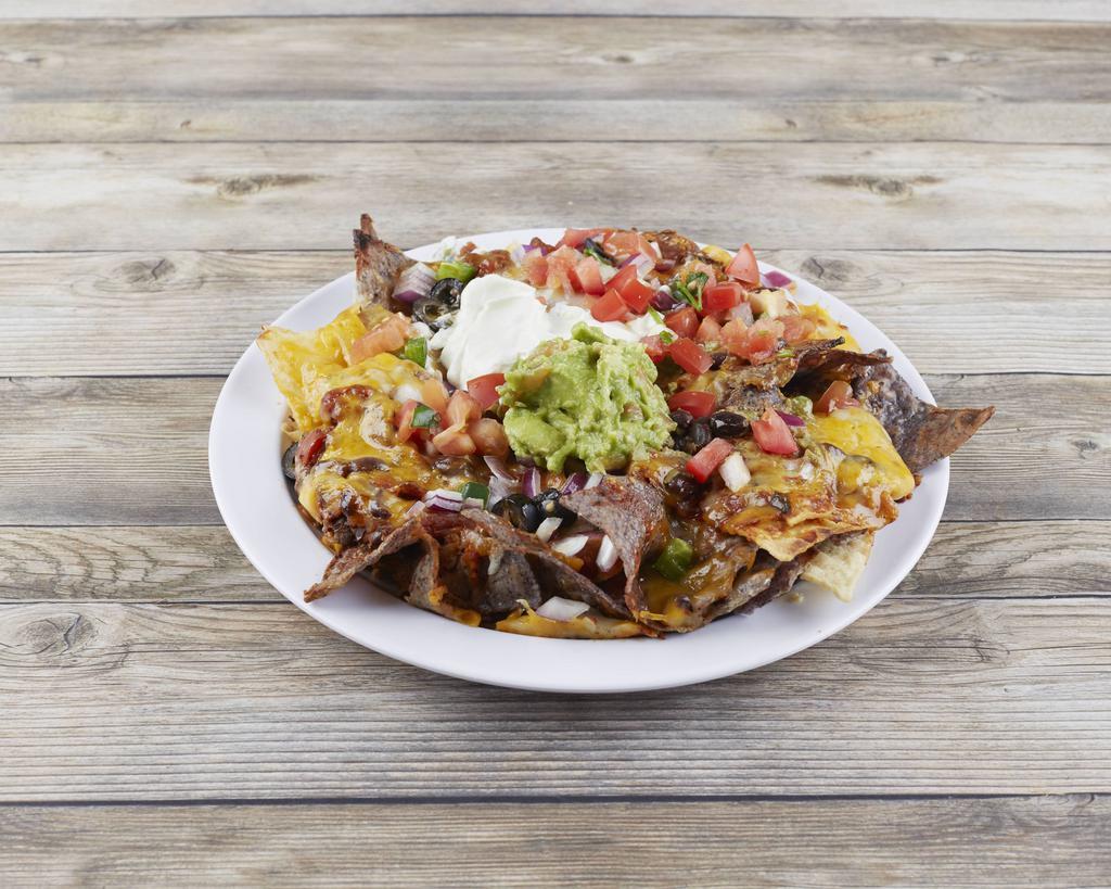 Nachos · Tortilla chips smothered with veggie chili, melted cheddar and Monterey Jack cheeses, topped with black olives, tomatoes, jalapenos, red onions, sour cream and guacamole. With Fiddler's fresh salsa.