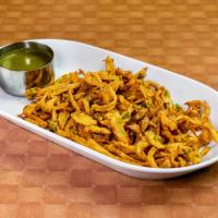 Vegetable Pakora · Assorted fresh vegetable fritters, fried and delicately spiced.