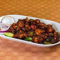Gongura Chilly Chicken Fry · Thigh chicken tossed in fry pan with sour leaf sauce